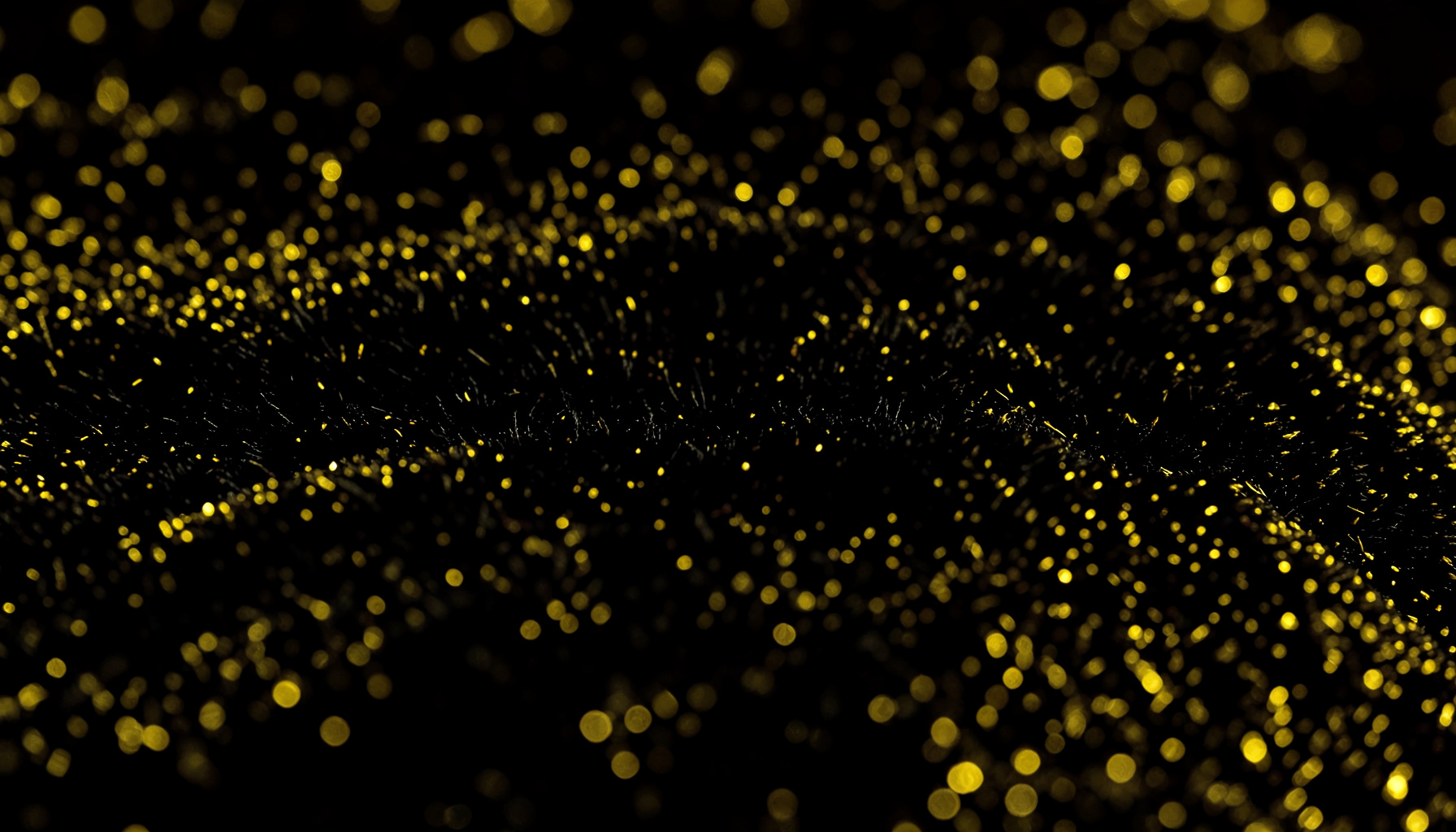 Primer plano extremo de una textura de terciopelo negro con reflejos dorados tenues, creando una atmósfera dramática y elegante de escenario.